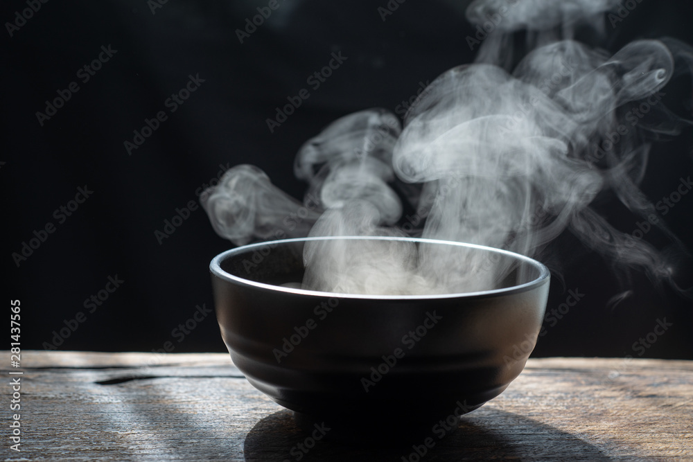 Steam of hot soup with smoke wood bowl on dark background.selective focus  Stock Photo | Adobe Stock