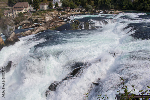 Rushing water during summer at the Rheinfalls photo