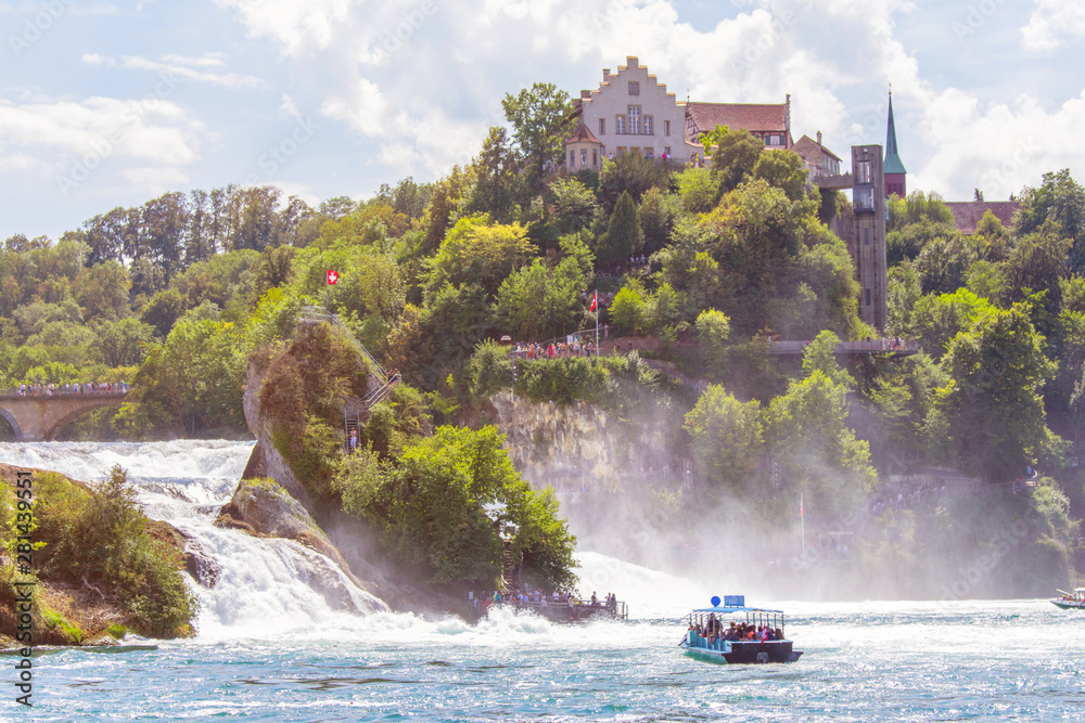 Fototapeta premium Sightseeing Boats crossing the Rhine at the Rhinefall 