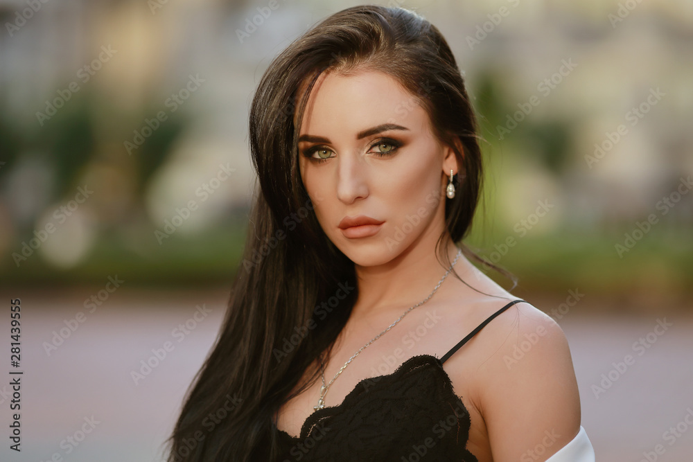 beautiful brunette woman with long hair in a white suit and lace top beautiful brunette woman with long hair in a white suit and lace top