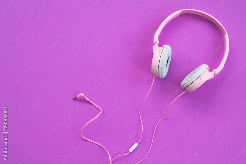 Pink headphones on pink background. Music concept Pink headphones on pink background. Music concept