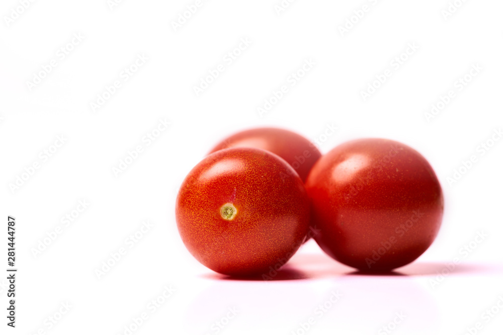 Three red tomatoes isolated on white background Three red tomatoes isolated on white background