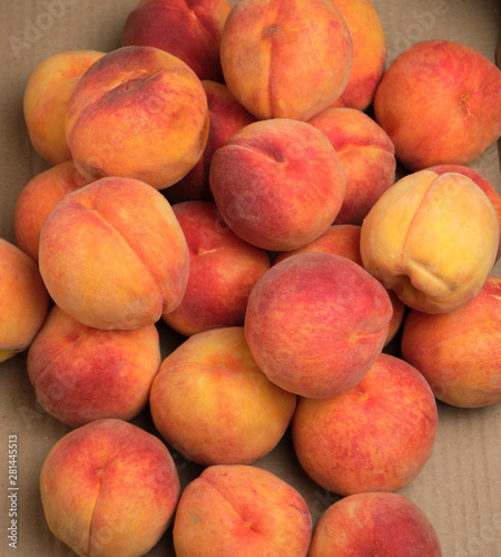 heap of ripe yellow-red round peaches
