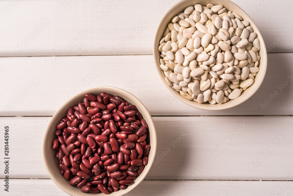 Assortment of peas, lentils, beans and legumes over white wooden background. Top view. Assortment of peas, lentils, beans and legumes over white wooden background. Top view.