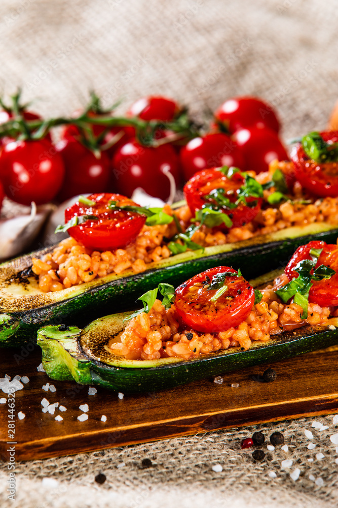 Stuffed zucchini with groats and vegetables