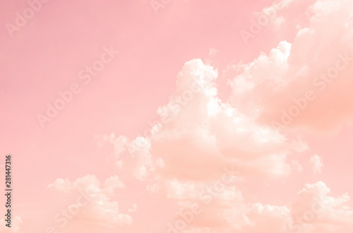 Pink sky with white clouds with blurred pattern background
