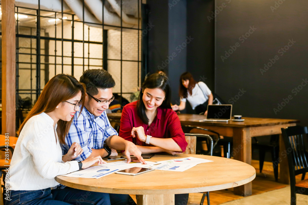 Group of three casual business meeting to discuss ideas and laptop on table in coffee shop. Group of three casual business meeting to discuss ideas and laptop on table in coffee shop.