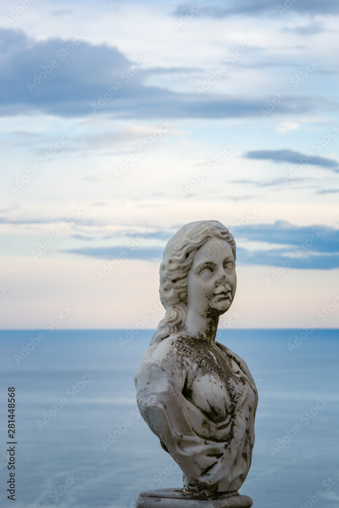 Women Statue from the belvedere, the so-called Terrazza dell'infinito, The Terrace of Infinity seen on the sunset, Villa Cimbrone, Ravello village, Amalfi coast of Italy