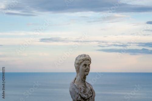Women Statue from the belvedere, the so-called Terrazza dell'infinito, The Terrace of Infinity seen on the sunset, Villa Cimbrone, Ravello village, Amalfi coast of Italy