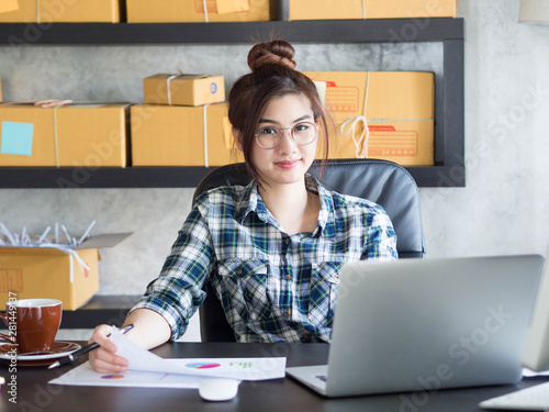 Young pretty teenage work at home with morning coffee. New generation life style of young entrepreneur photo