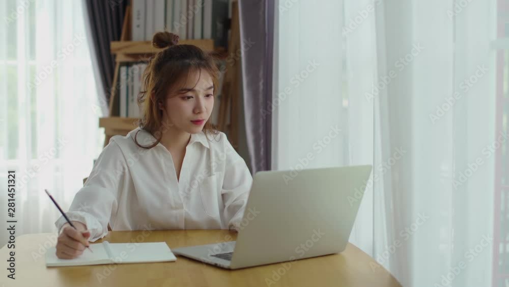 Pretty woman working with laptop computer at home Pretty woman working with laptop computer at home
