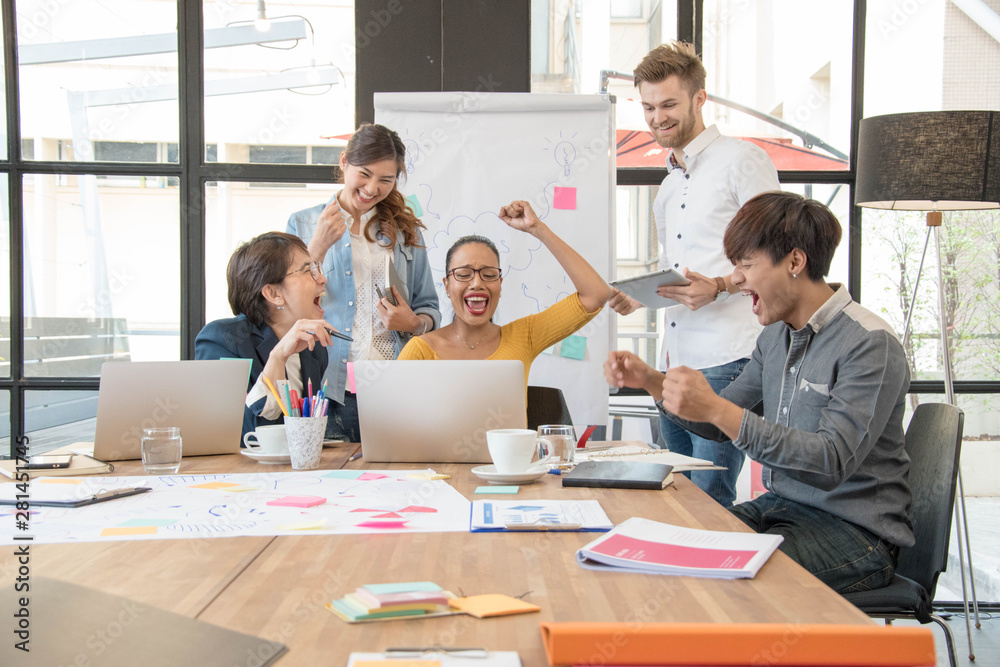 Successful casual business teamwork celebrating at the office,Creative concept.