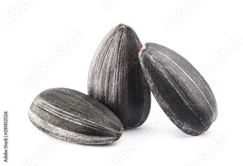 Wallpaper Mural Close-up of three delicious sunflower black seeds, isolated on white background Torontodigital.ca