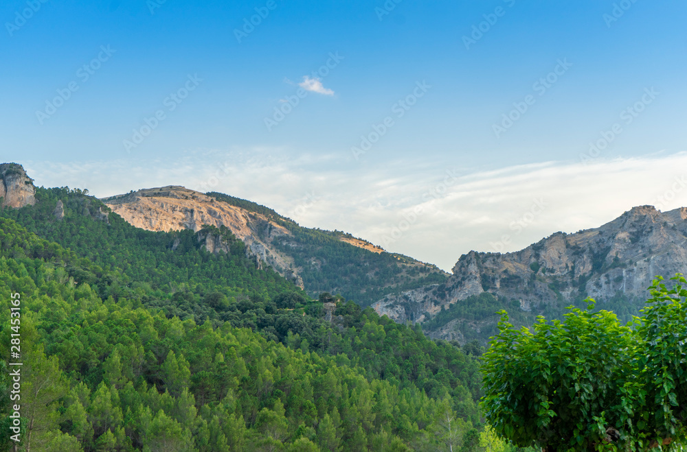 Mountains with abundant vegetation and blue sky