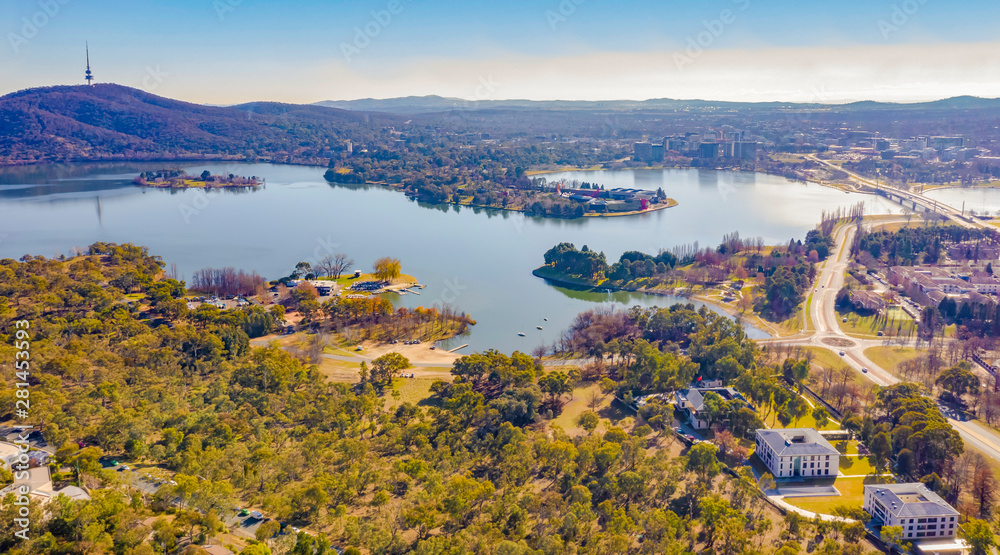 Panorama view of Canberra, the capital city of Australia, looking north over Lake Burley Griffin with Black Mountain and Telstra Tower to the left and Commonwealth Bridge at right