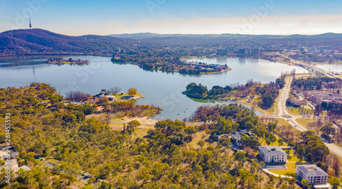 Panorama view of Canberra, the capital city of Australia, looking north over Lake Burley Griffin with Black Mountain and Telstra Tower to the left and Commonwealth Bridge at right photo