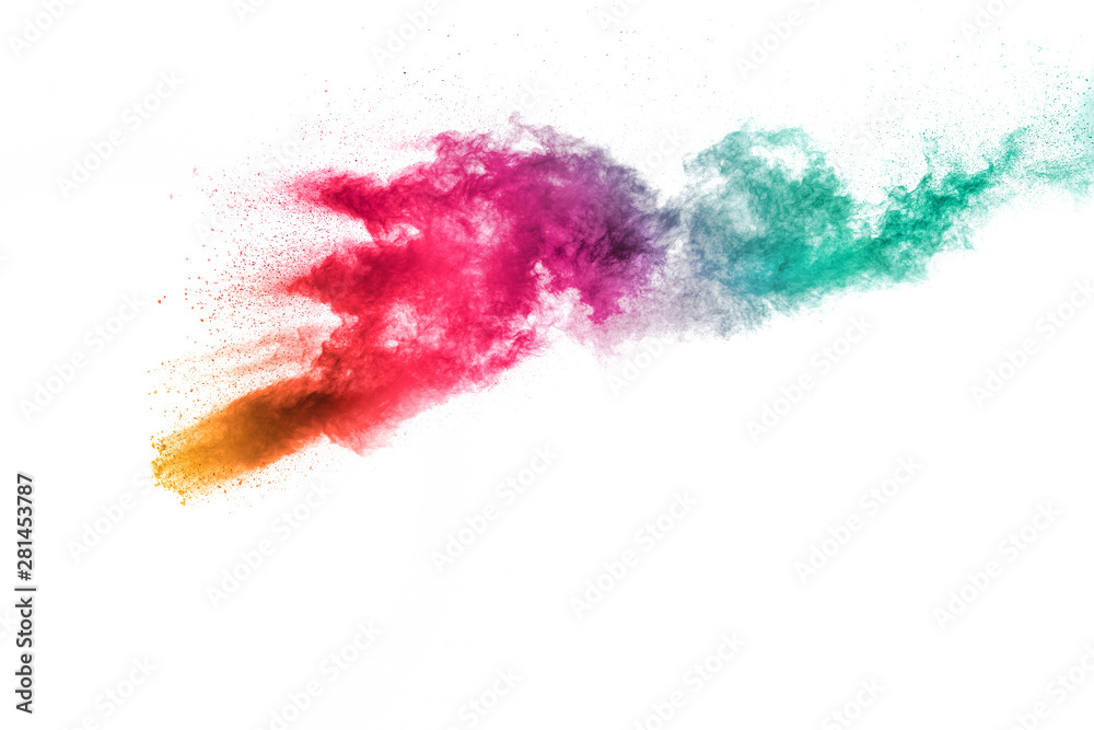 Abstract multi color powder explosion on white background.Freeze motion of dust particles splash.