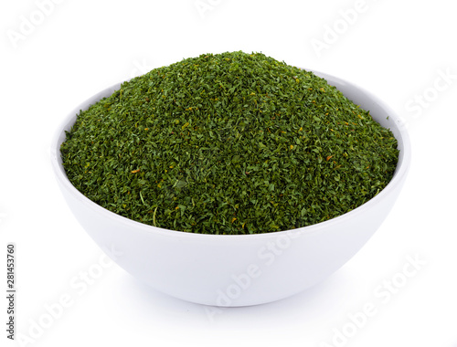 dried parsley in bowl isolated on white background