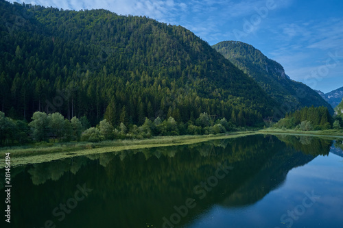 Aerial photography. Panoramic view of a small lake north of Italy. Trento region. Great trip to the lake in the Alps. © Berg