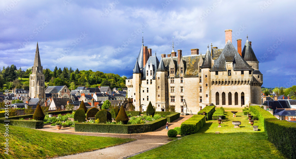 Fototapeta premium Langeais Castle path between green gardens. Empty road to French chateau no people. Loire Valley landscaping. Beautiful manicured lawn. Medieval architecture. France travel. 8K