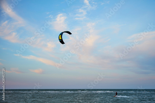 a surfer kite surfing the waves