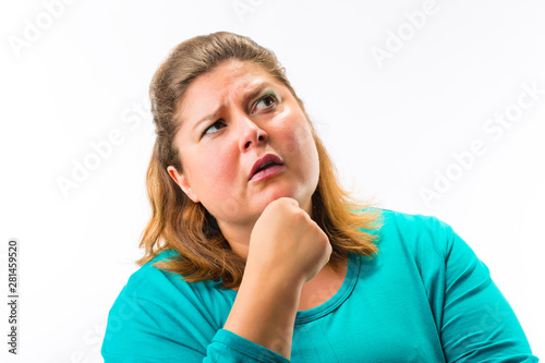 Thoughtful woman with hand on her chin