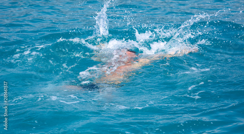 A man swims in the water in the water © schankz