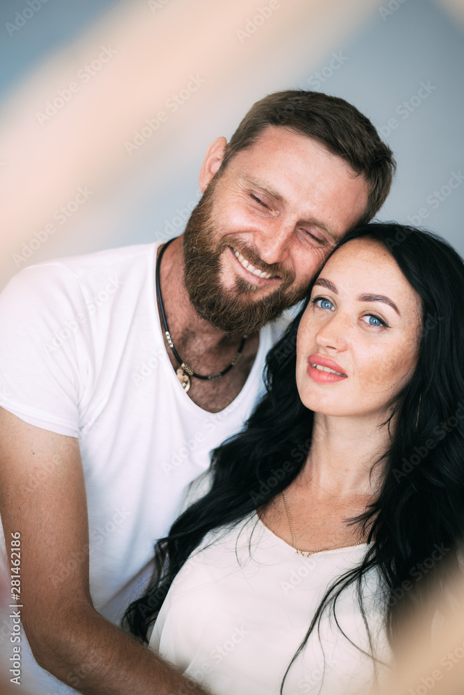 Loving couple woman and man with beard soft light from window Loving couple woman and man with beard soft light from window
