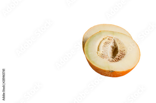 Halves of ripe melon with seeds, yellow peel on a white background. Isolated. Close-up.