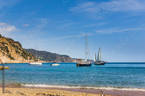 Stationary sailing boats seen from the beach in Costa Brava, Catalonia (Spain)