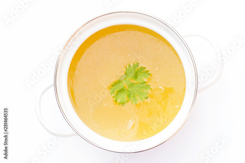 Pot of chicken broth isolated on white background. photo
