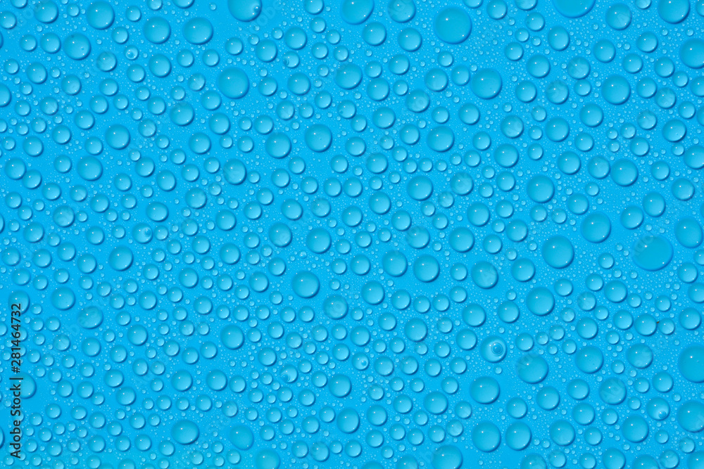 closeup drops water on blue background