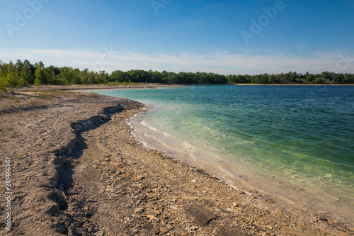 Azure lake called Osadnik Gajowka near Psary village, Poland photo