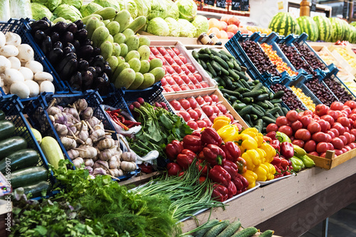Vegetable farmer market counter: colorful various fresh organic healthy vegetables at grocery store. Healthy natural food concept