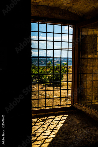 Panoramic view from window with grilles