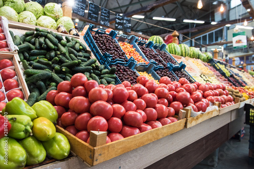 Vegetable farmer market counter: colorful various fresh organic healthy vegetables at grocery store. Healthy natural food concept