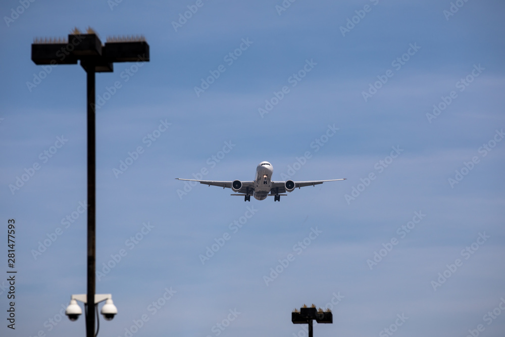Airplane during landing approach at the airport