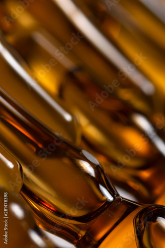 Medicinal dark viials on white background. High resolution image for pharmaceutical industry.