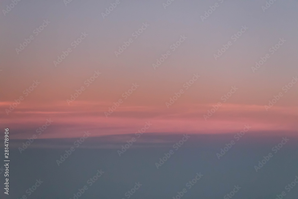 Pink, Orange, and blue sunrise outside of plane window, Plane view of beautiful sunset