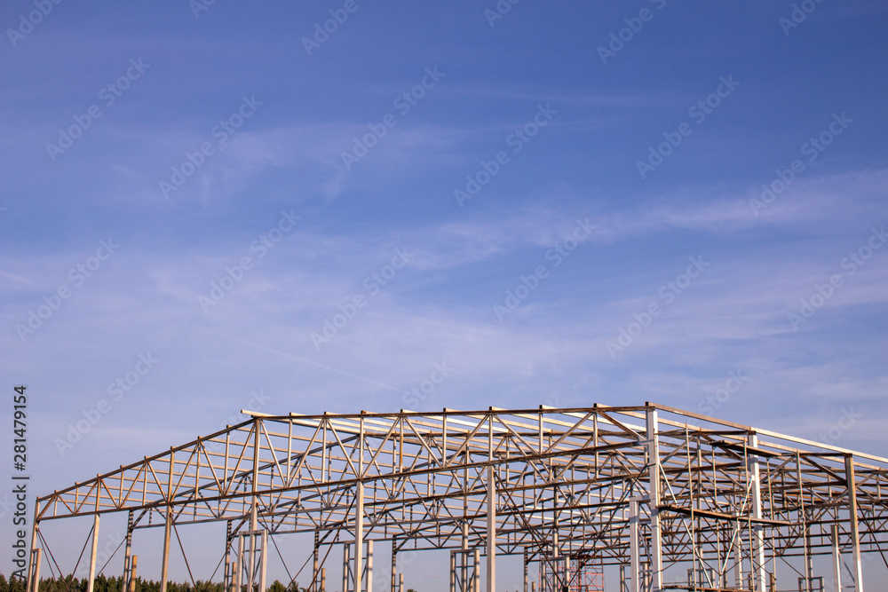 Construction of a warehouse building. Unfinished construction of the hangar.