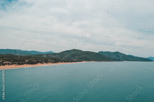 Green ocean shore and beach in Hainan island  China.