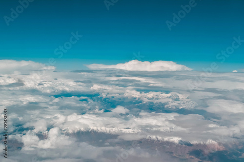 Clouds and mountains. Airplane view.