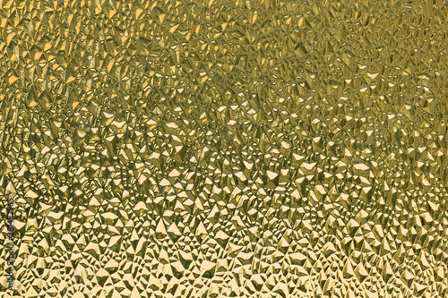 Yellow ribbed glass surface. Abstract background. Design element.