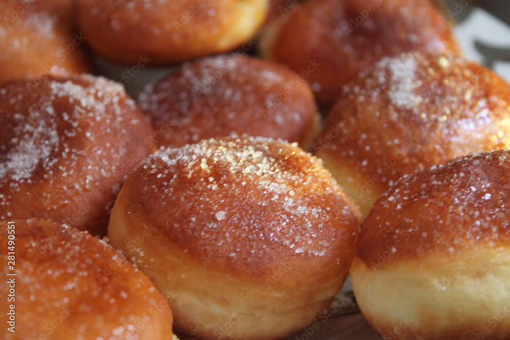 donuts with powdered sugar on plate donuts with powdered sugar on plate