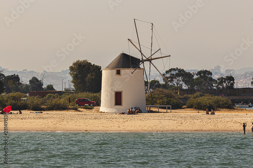 Alburrica windmills, estuary river windmills, landscape, Portugal photo
