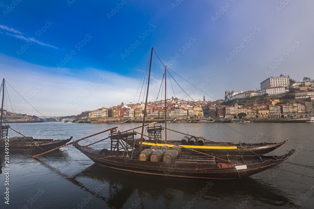 Traditional boats with barrels on the Douro river, Ribeira and Dom Luis bridge, Porto, Portugal. Traditional boats with barrels on the Douro river, Ribeira and Dom Luis bridge, Porto, Portugal.
