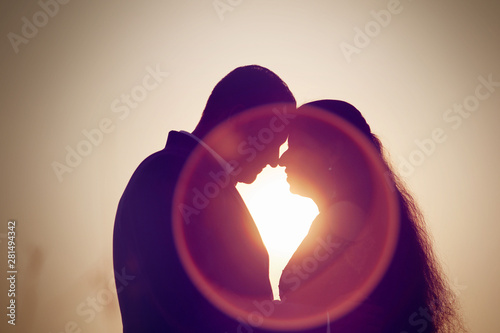 Couple standing in sunset time photo