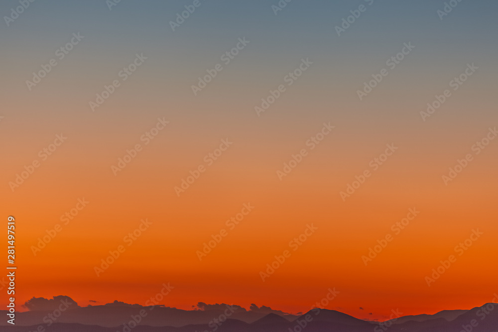 Beautiful profile of Aegean Sea islands at sunset with colorful sky