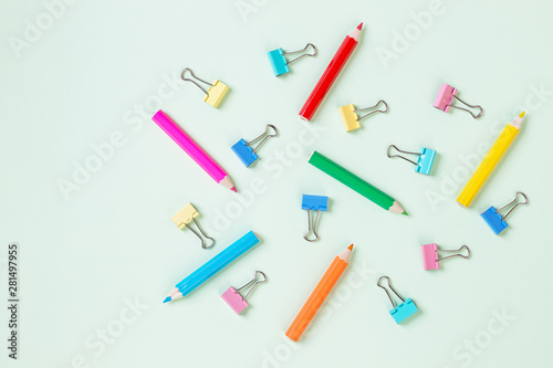 School equipment. Variety of school supplies. Flat lay.Flat lay photo of pastel background with colorful pencil and paper clip,copy space top view. concept of preparation for school. Pattern.