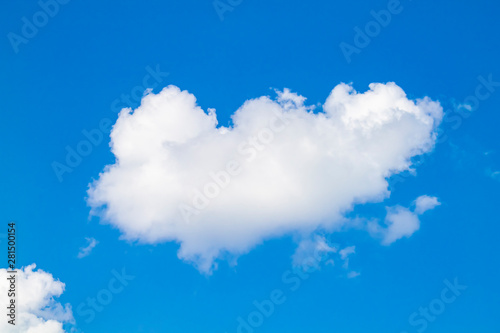 white clouds against the blue sky.